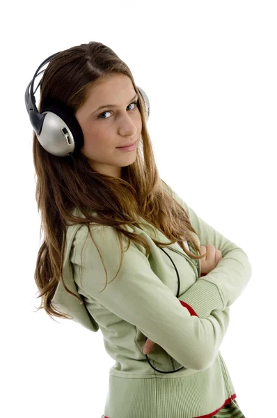 Female listening to music, folded arms — Stock Photo, Image
