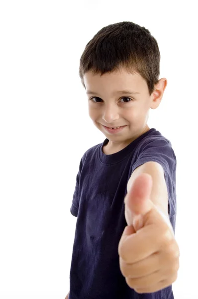Roztomilý školy chlapec ukazuje palec — Stock fotografie