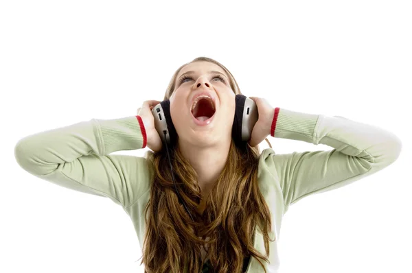 Female looking up enjoying loud music — Stock Photo, Image
