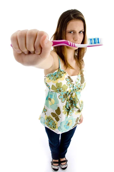 Mooie vrouw bedrijf tandenborstel — Stockfoto