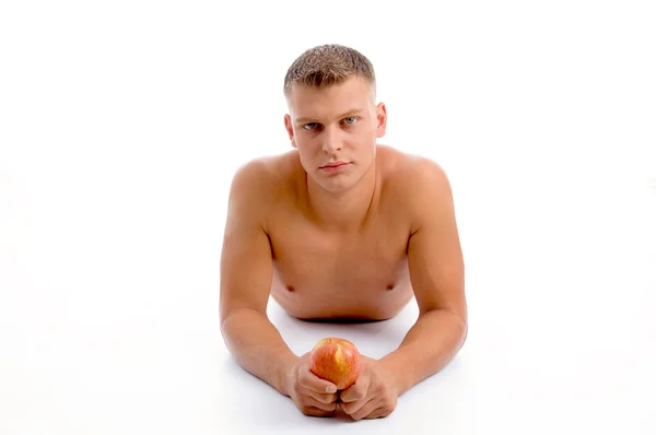 Ung vältränad kille håller ett äpple — Stockfoto