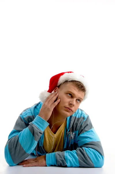 Thinking man wearing christmas hat — Stock Photo, Image