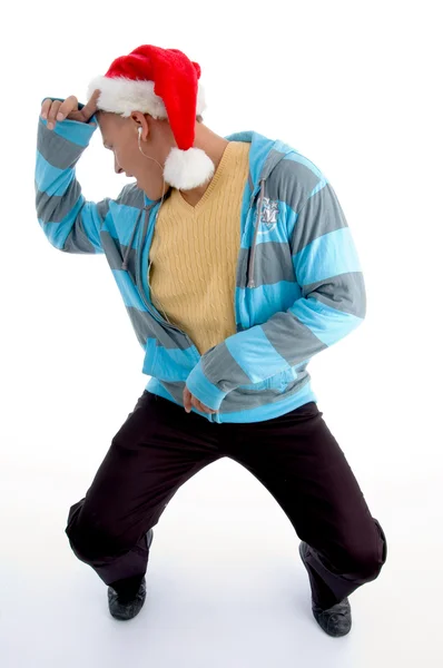 Танцующий мужчина в рождественской шляпе — стоковое фото