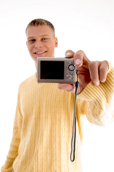 Knappe jonge kerel met digitale camera — Stockfoto