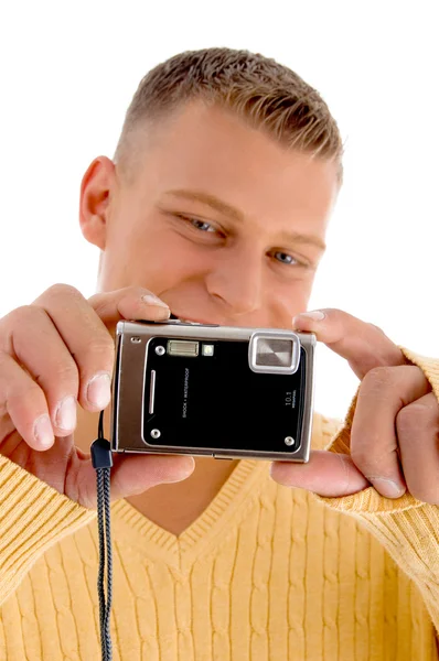 Handsome young guy with digital camera — Stock Photo, Image