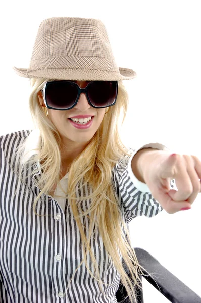 Woman in hat pointing at camera — Stock Photo, Image