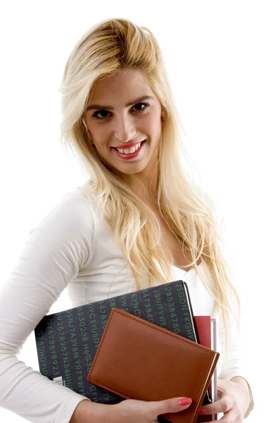 Usměvavý mladý student drží knihy — Stock fotografie