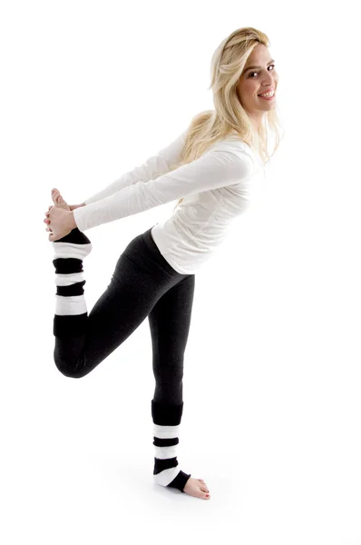 Woman stretching her leg and back — Stock Photo, Image