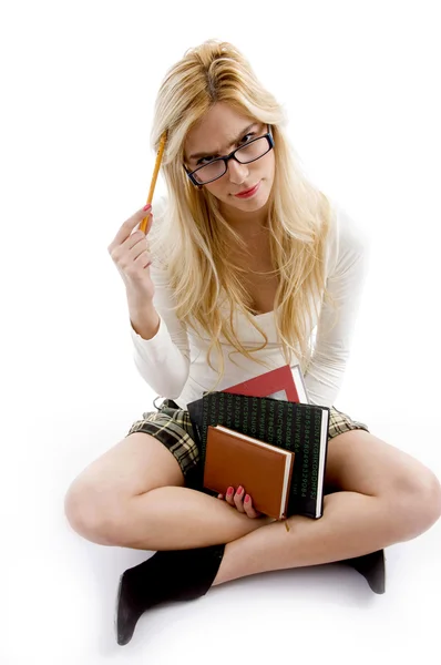 Young student with books facing camera — Stock Photo, Image