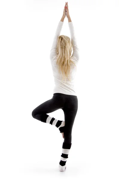 Postura traseira da mulher exercitando — Fotografia de Stock