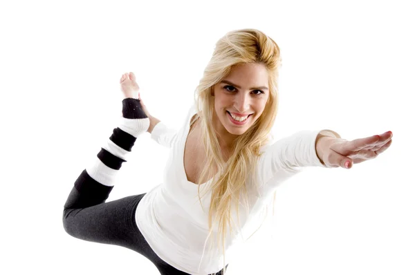 Smilende kvinde gør stretching motion - Stock-foto