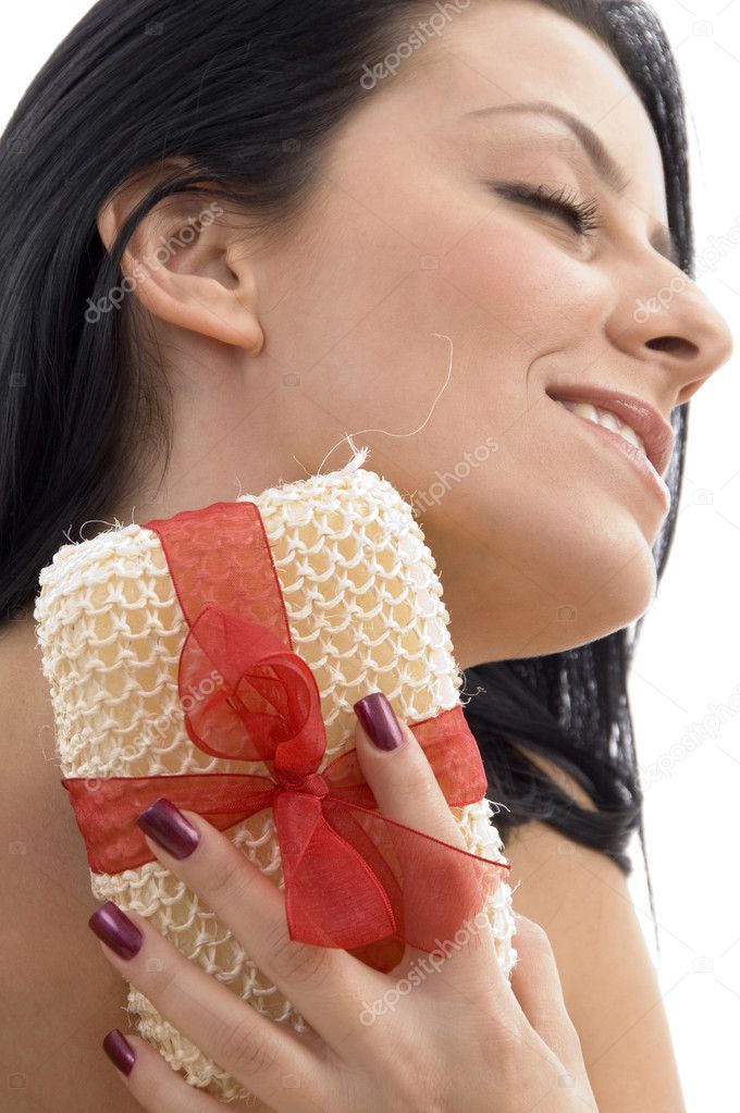 Close up of woman applying scrubber