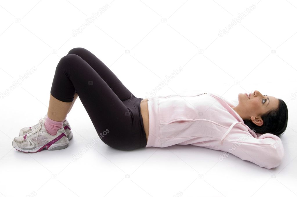 Young fit woman relaxing on floor