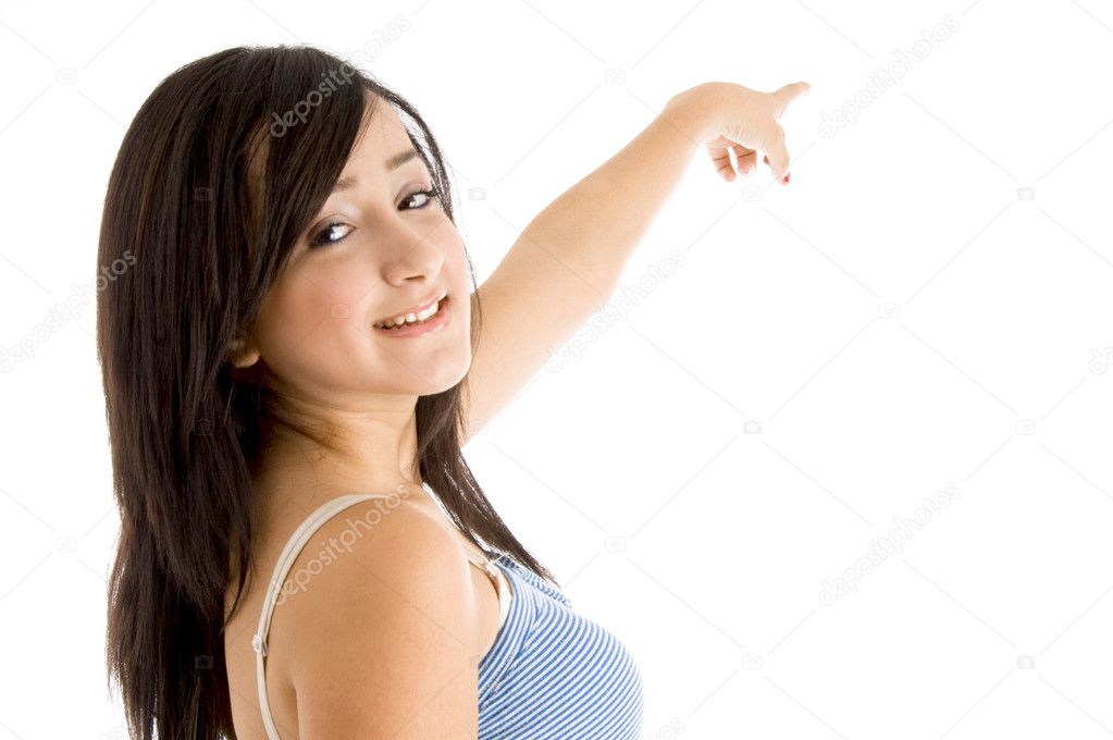 Back pose of smiling girl pointing