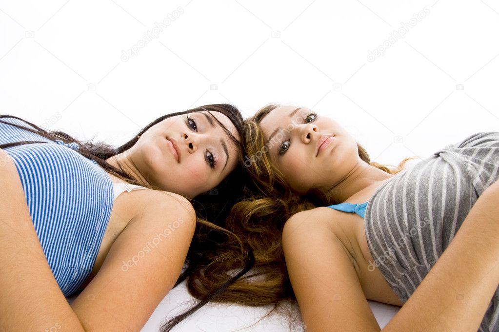 Teenage girls lying on floor