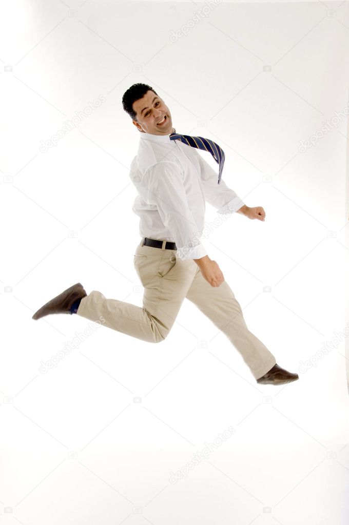 Businessman leaping in mid air