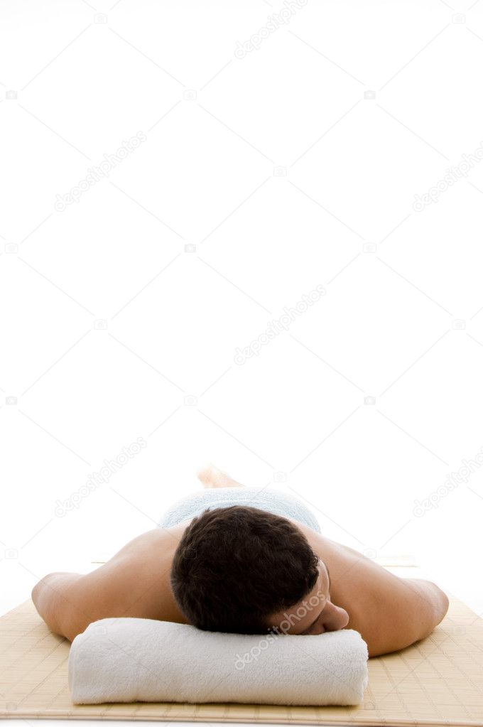 Relaxed young man resting at day spa