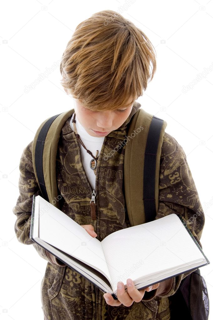 School child reading a book