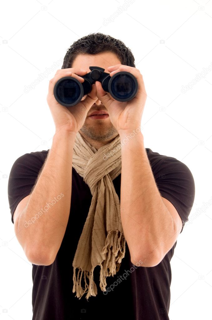 Young male holding binoculars