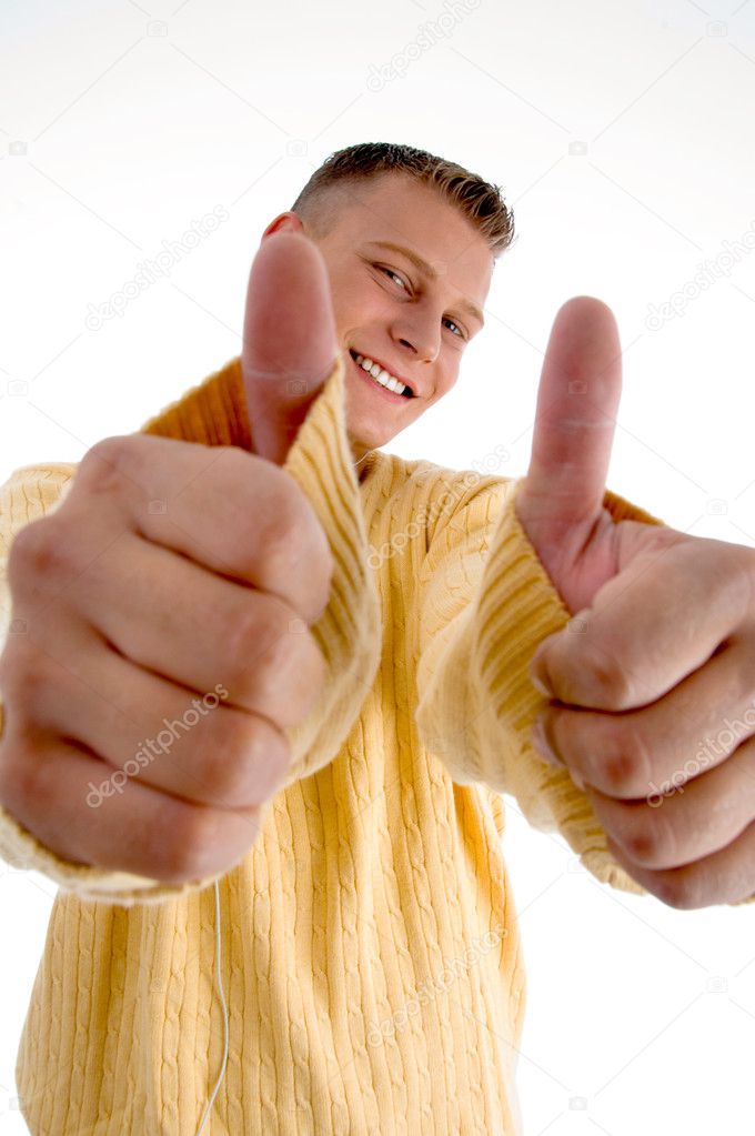 Smiling man showing thumbs up