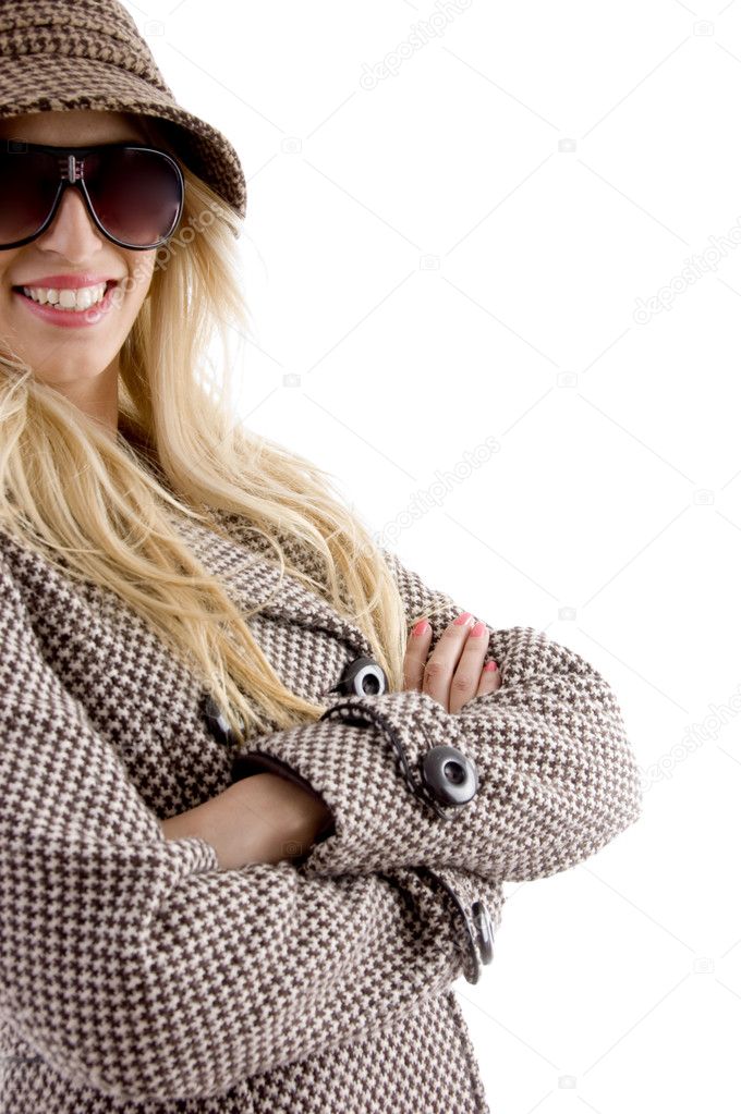 Pleased woman in overcoat, smiling
