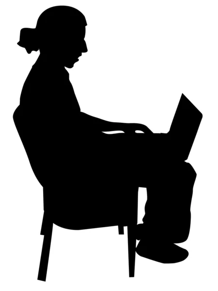 Молодой человек занят ноутбуком — стоковое фото