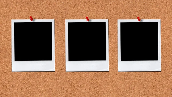 Three aligned Polaroids with red pins — Stock Photo, Image