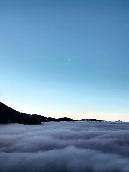 Sea of clouds with moon