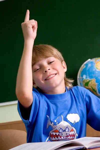 Trött skolpojke med handen upp — Stockfoto