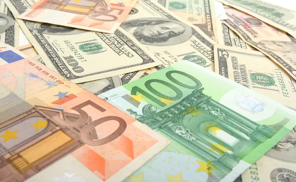 Доллары и евро — стоковое фото