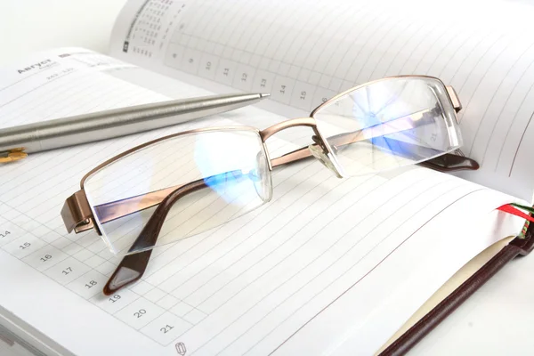 stock image Notebook, pen and eyeglasses