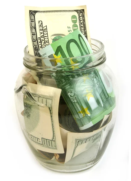 Dollar en euro rekeningen in glazen pot — Stockfoto