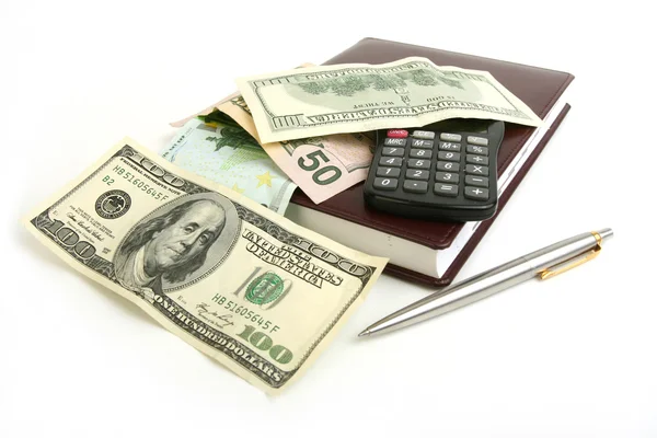 Pengar, notebook, penna och miniräknare — Stockfoto