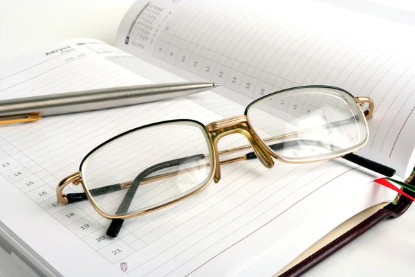 stock image Notebook, pen and eyeglasses