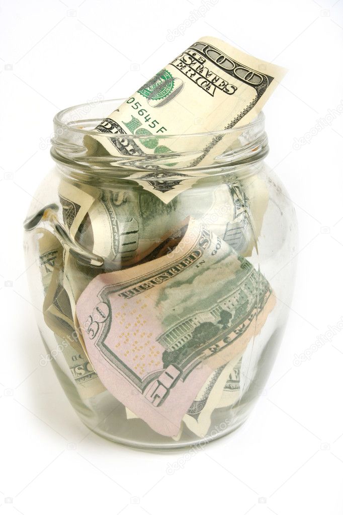Dollar bills in glass jar