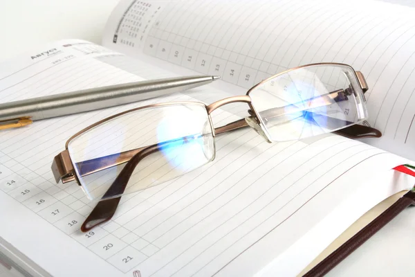 stock image Notebook, pen and eyeglasses