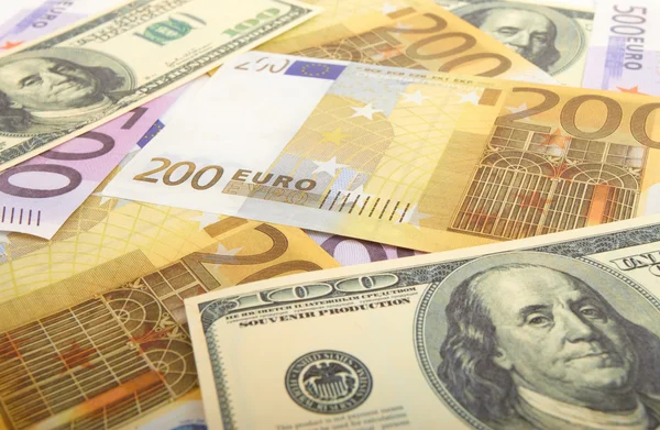 Hintergrund der Dollar- und Euroscheine Stockbild