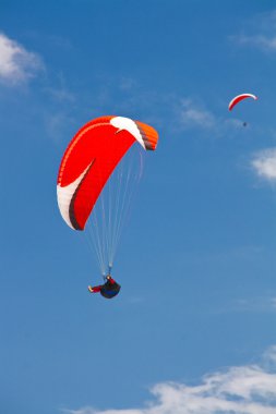 Paragliding in Turkey in blue sky clipart