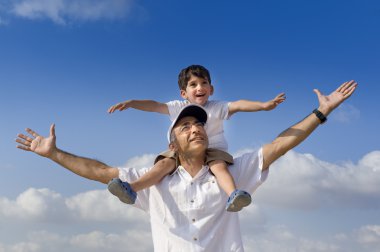 Child on man shoulders