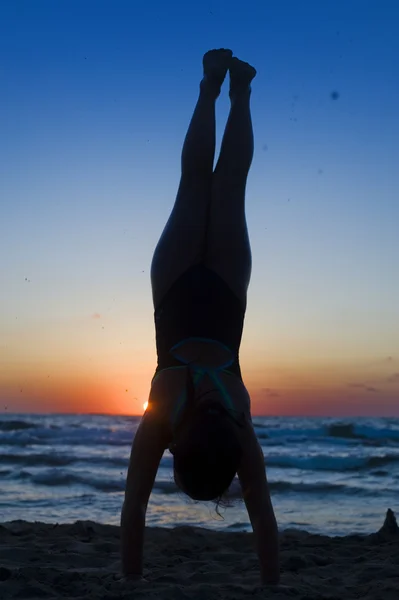 Stock image Handstand silhouette beach