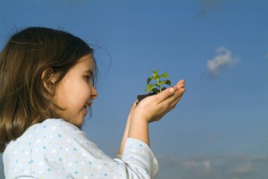 Child hands holding plant clipart