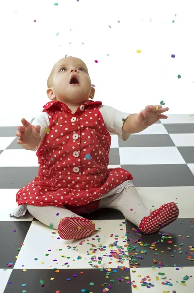 Baby girl and confetti — Stock Photo, Image