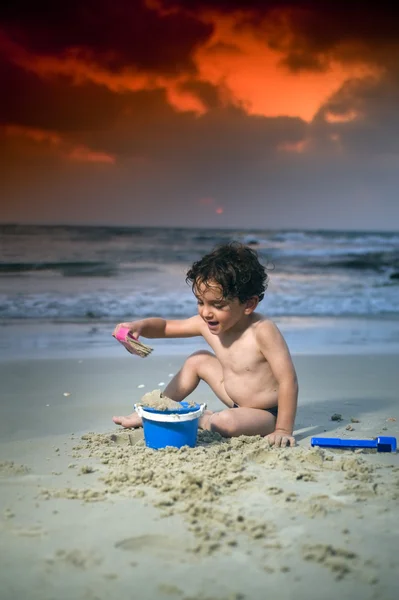 Boy play beach sunset — Stock Photo, Image