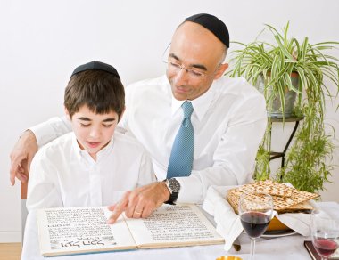 Father and son celebrating passover clipart