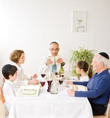 Jewish family celebrating passover clipart