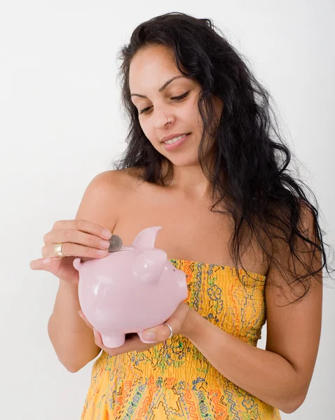 Hispanic woman and piggybank — Stock Photo, Image