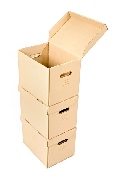 Uma caixa aberta em uma pilha — Fotografia de Stock