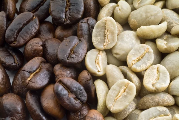 stock image Black and green coffee beans