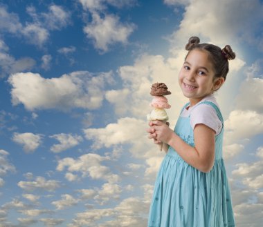 Little girl a cone with three ice cream flavors clipart