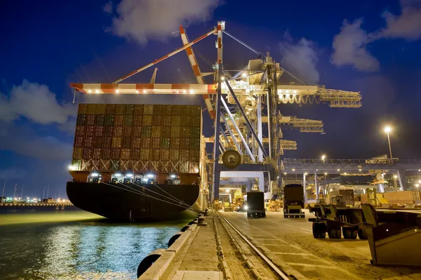 stock image Cargo ship by night